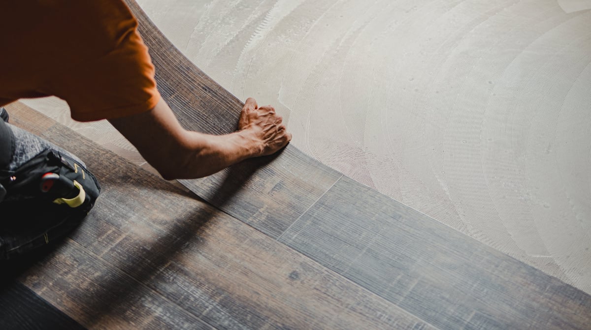 Professional flooring installer at work